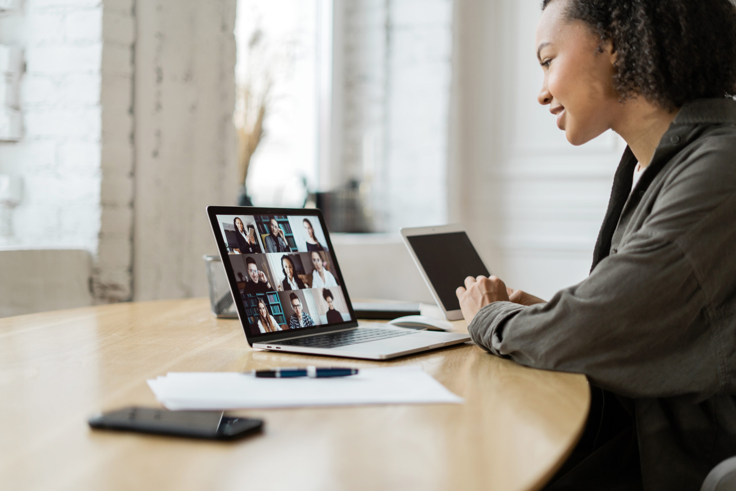 video-communication-woman-with-colleagues-freelancer-workplace-uses-laptop-computer-company-report Video communication woman with colleagues freelancer workplace uses laptop computer company report in office coworking space